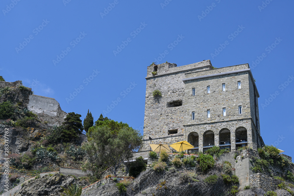 Restaurant in the former fortress of Monterosso, one of the famous cinque terra mountain villages with colorful houses, tourist attraction on the Mediterranean sea coast in Liguria, Italy, copy space
