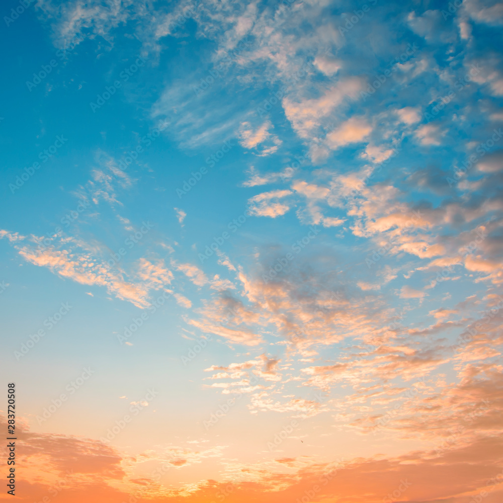 Fototapeta premium Beautiful sunrise sky with orange clouds