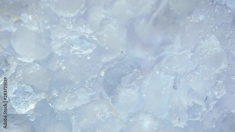 Water is pouring on crushed ice. Concept refresh Water is pouring on crushed ice. Concept refresh