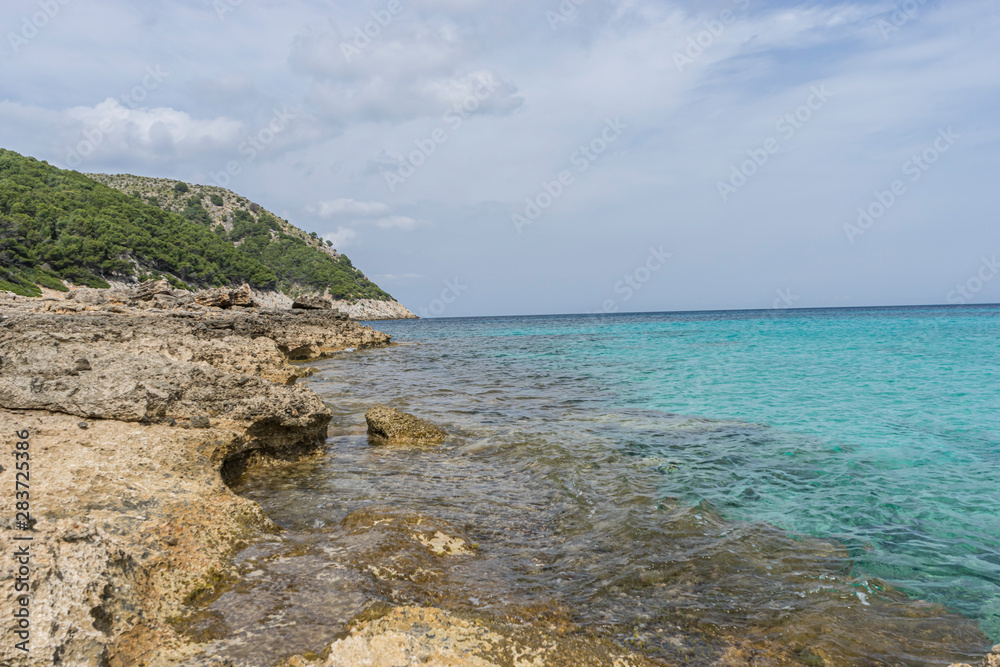 turquoise Mediterranean sea waters on the beaches of the island of Mallorca, Balearic Islands, Spain