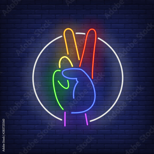 Hand showing victory sign with LGBT colors neon sign