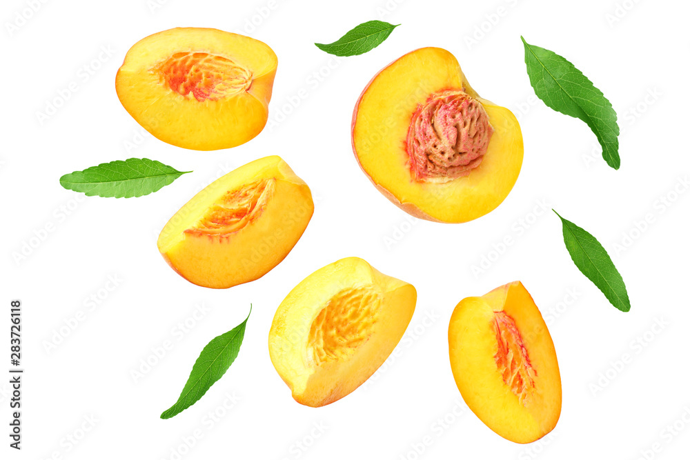 peach fruit slices with green leaves isolated on white background. top view peach fruit slices with green leaves isolated on white background. top view