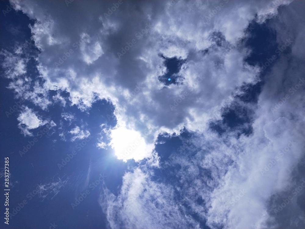Blue sky with a lots of clouds and a bright sun. Blue sky with a lots of clouds and a bright sun.