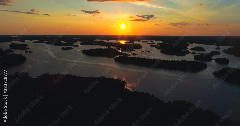 Archipelago, Aerial, drone shot over a lot of small islands, in the saaristo, on the Gulf of Finland sea, at sunset on a summer evening dusk, in Tammisaari national park, Raasepori, Uusimaa, suomi