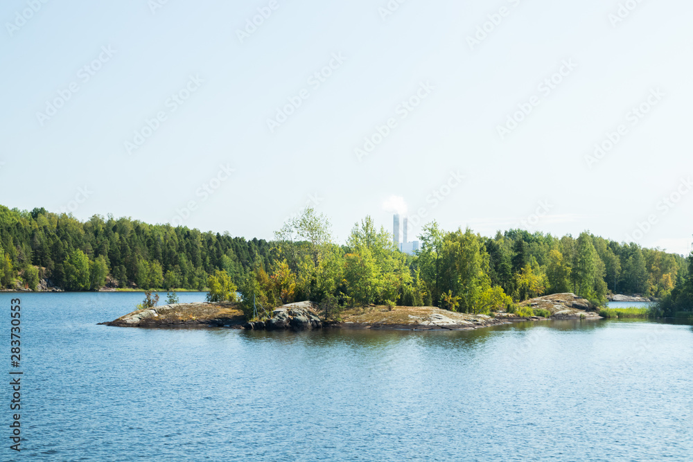 Small rocky island in lake Saimaa, near lappeenranta, Finland.