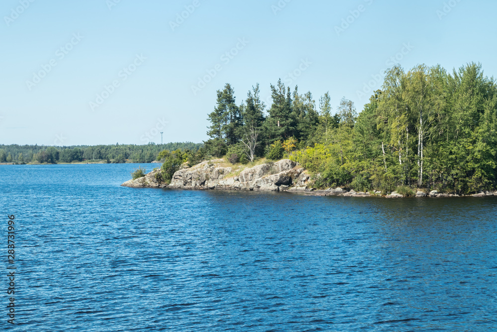 Small rocky island in lake Saimaa, near lappeenranta, Finland.