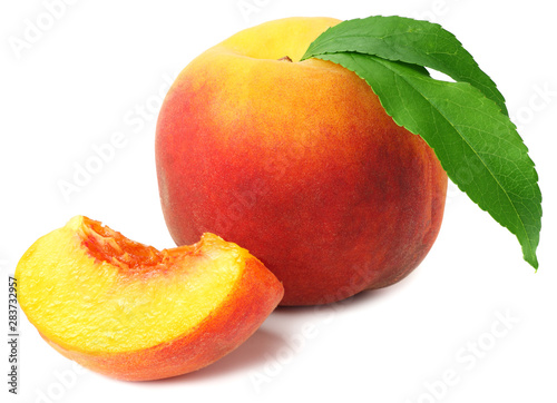 peach fruit with green leaves and slices isolated on white background
