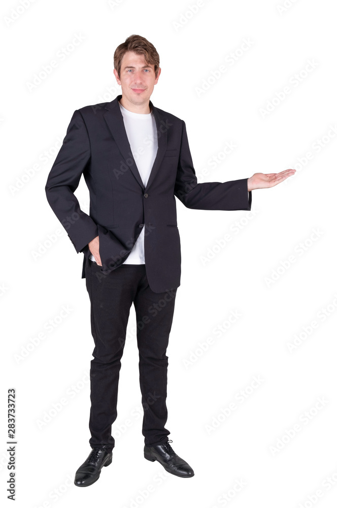 Full length portrait of handsome standing posing businessman and holding copyspace on the palm and looking straight at the camera, isolated on white background.