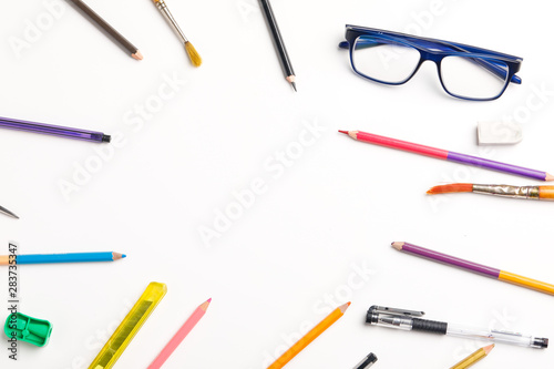 The concept of the teacher's day, School stationery, pencil, pen, note, Spectacles, tie in pen box on white background