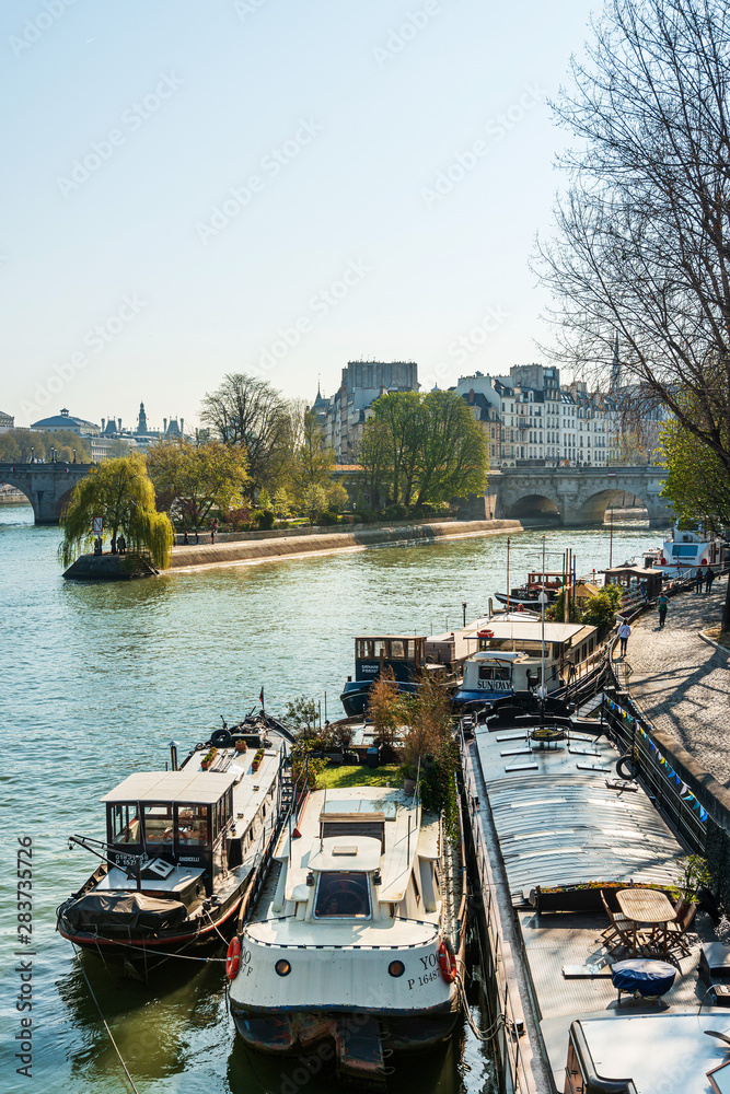 Obraz premium PARIS, FRANCE - MARCH 31, 2019: Street view of river Seine in Paris city, France.