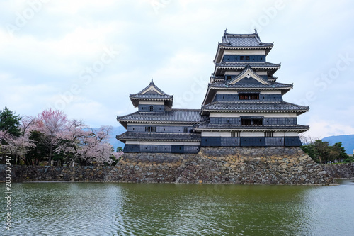 Matsumoto castle, the traditional Japanese building castle in the cloudy day