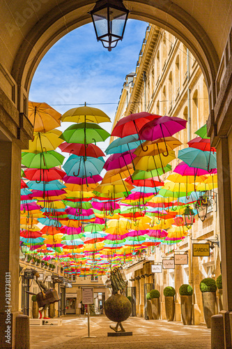 colorful umbrellas in village royale paris, france. © JR Araújo Photo