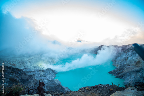 Aerial view of beautiful Ijen volcano with acid lake and sulfur gas going from crater, Indonesia