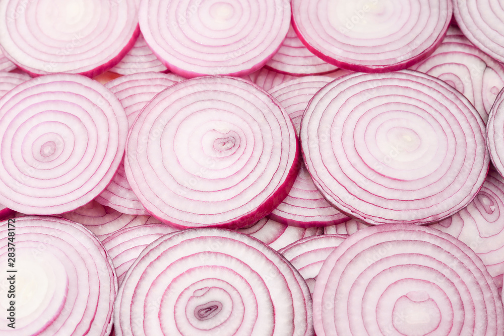 Onion slices as a background. Top view. Onion slices as a background. Top view.