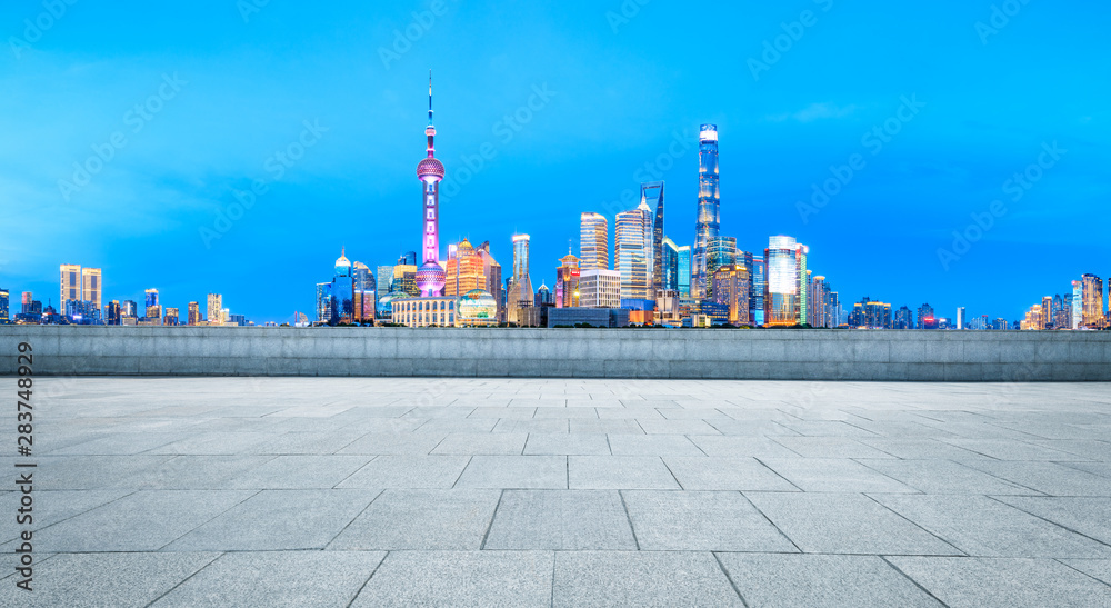 Shanghai cityscape and square floor at night