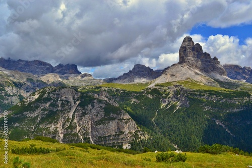 Beautiful day in Dolomites Mountains  Italy. Tre Cime on background. Picture takem from Monte Piano Mountain.