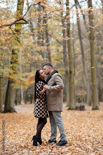Autumn love, couple kissing in fall park, happy man and woman outside.  Love story. To love each other.  © Tetiana Moish