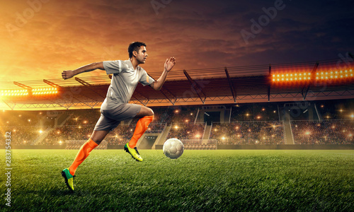 Soccer player dribbles a ball