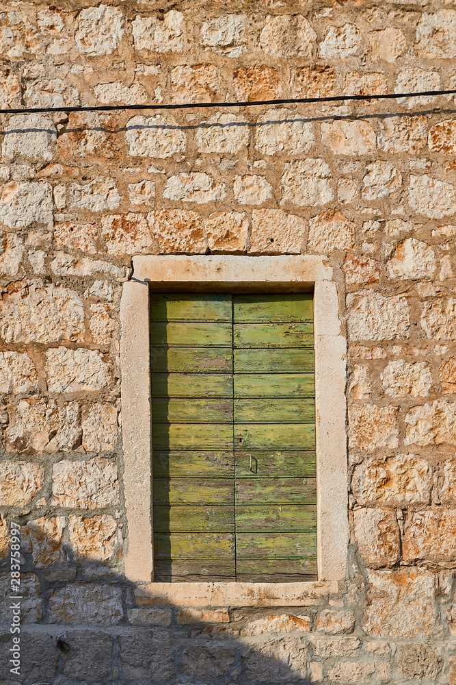 Wooden windows in a stone building