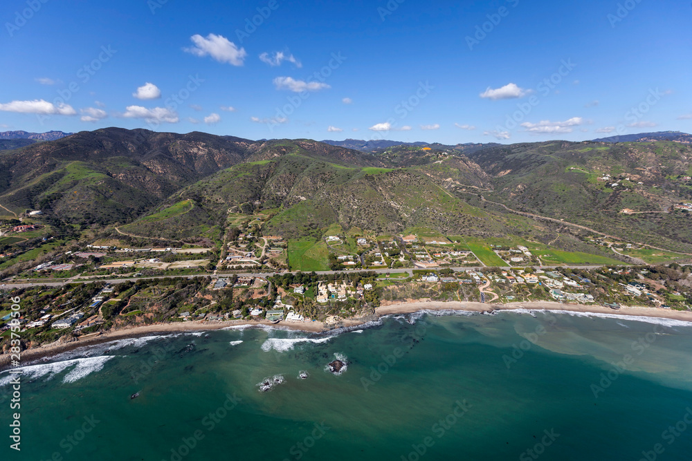 Aerial view of shoreline homes and estates on the north end of Malibu on the scenic Southern California coast.