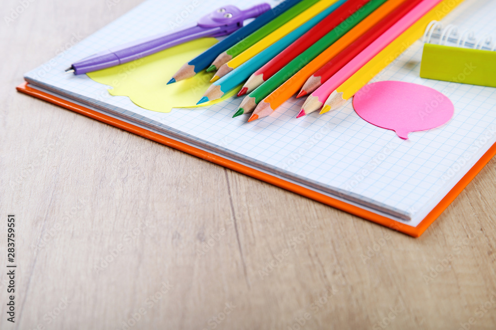 School supplies on brown wooden table School supplies on brown wooden table