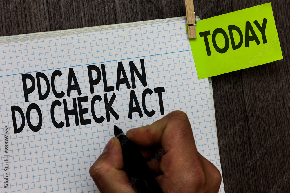 Word writing text Pdca Plan Do Check Act. Business concept for Deming Wheel improved Process in Resolving Problems Man holding marker notebook clothespin hold reminder wooden background Word writing text Pdca Plan Do Check Act. Business concept for Deming Wheel improved Process in Resolving Problems Man holding marker notebook clothespin hold reminder wooden background