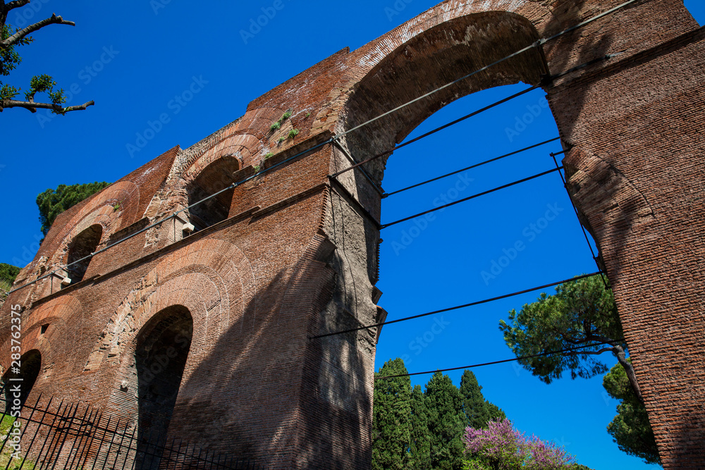 Fototapeta premium Remains of the Aqua Claudia an ancient Roman aqueduct begun by Emperor Caligula in 38 AD and finished by Emperor Claudius in 52 AD