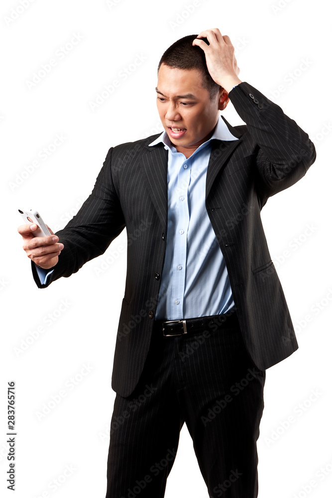 Angry young man shouting using mobile over white background Angry young man shouting using mobile over white background