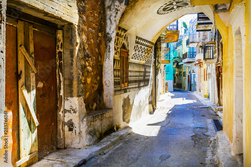 Fototapeta Naklejka Na Ścianę i Meble -  Charming old narrow streets of traditional village in Greece - Pyrgi , Chios island