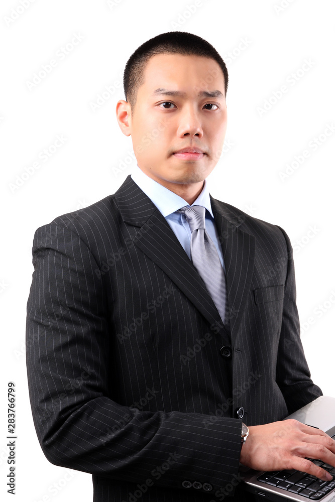 Young asian businessman holding laptop Young asian businessman holding laptop