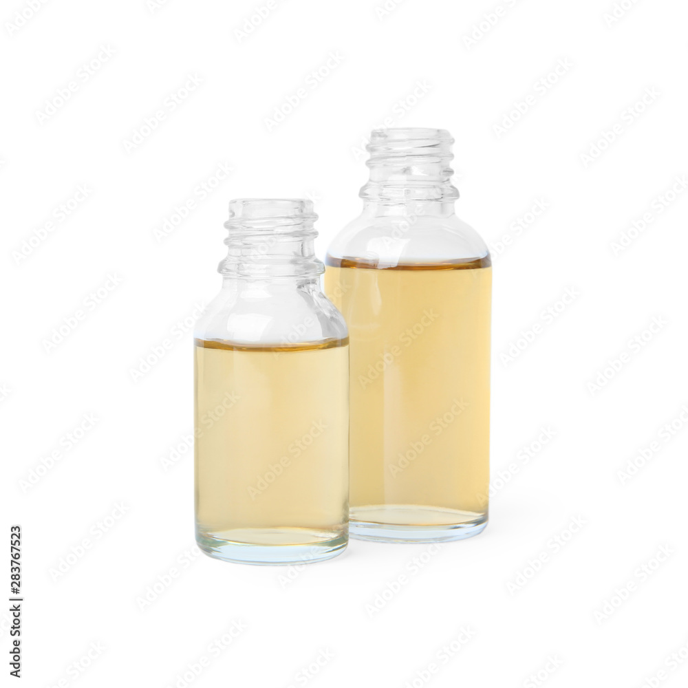 Glass bottles of essential oils on white background Glass bottles of essential oils on white background