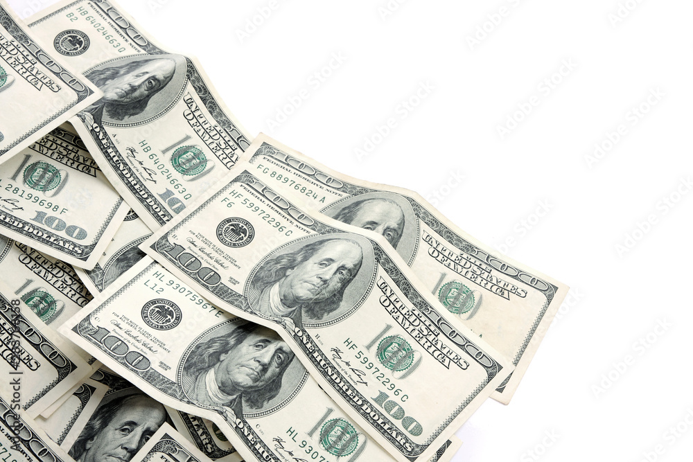 A lot of one hundred dollar bills isolated on white A lot of one hundred dollar bills isolated on white