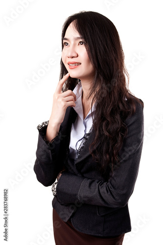 Beautiful Asian young business woman is thinking