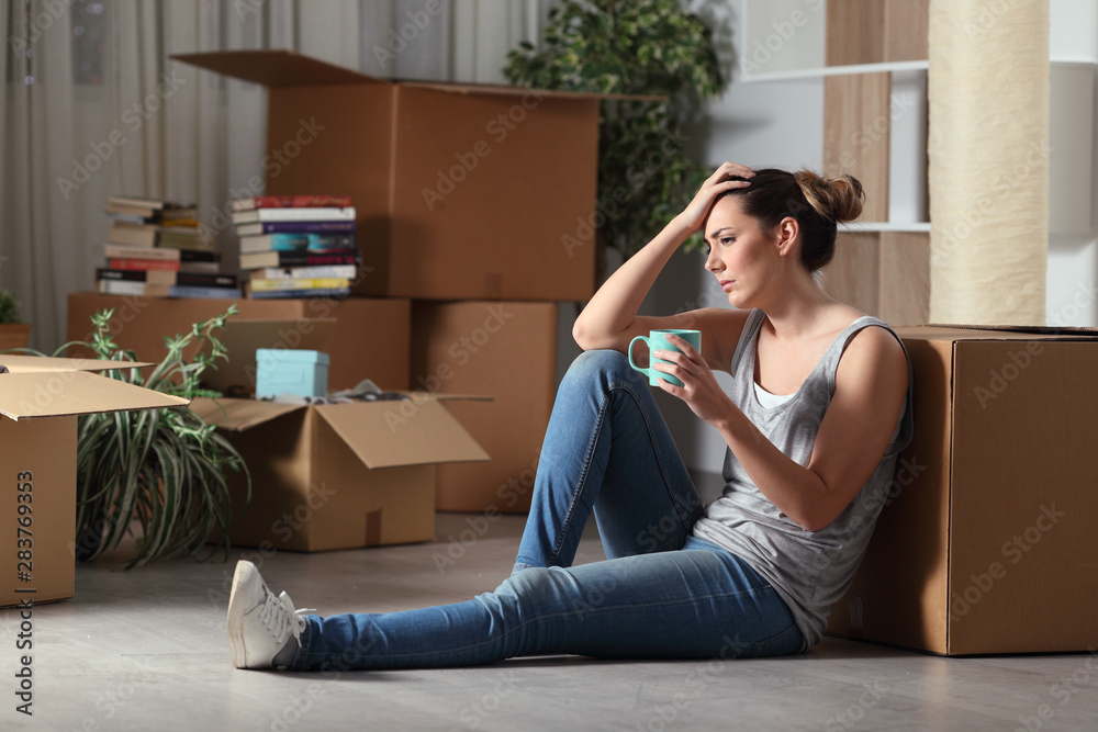 Sad evicted tenant moving home complaining on the floor - obrazy, fototapety, plakaty 