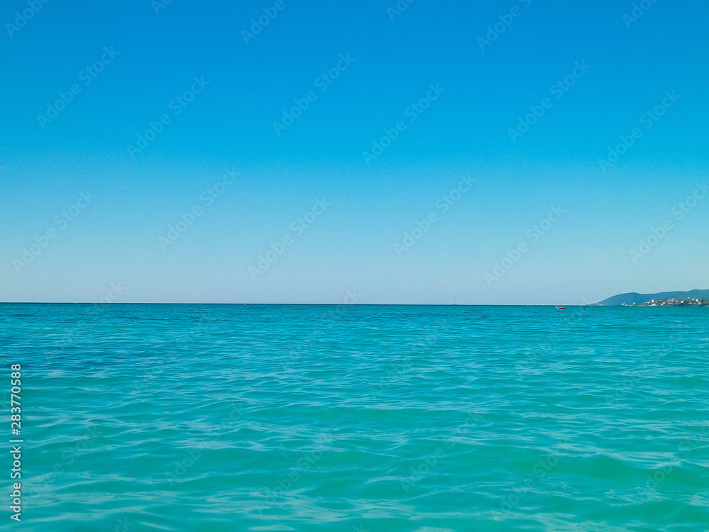 Blue water of Tyrrhenian sea in Vada, Tuscany, Italy.