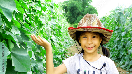 farmer cute girl with green farm background