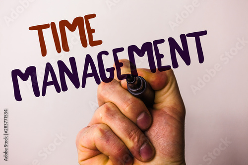 Word writing text Time Management. Business concept for Schedule Planned for Job Efficiency Meeting Deadlines Man holding pen pointing idea message black red letters white background