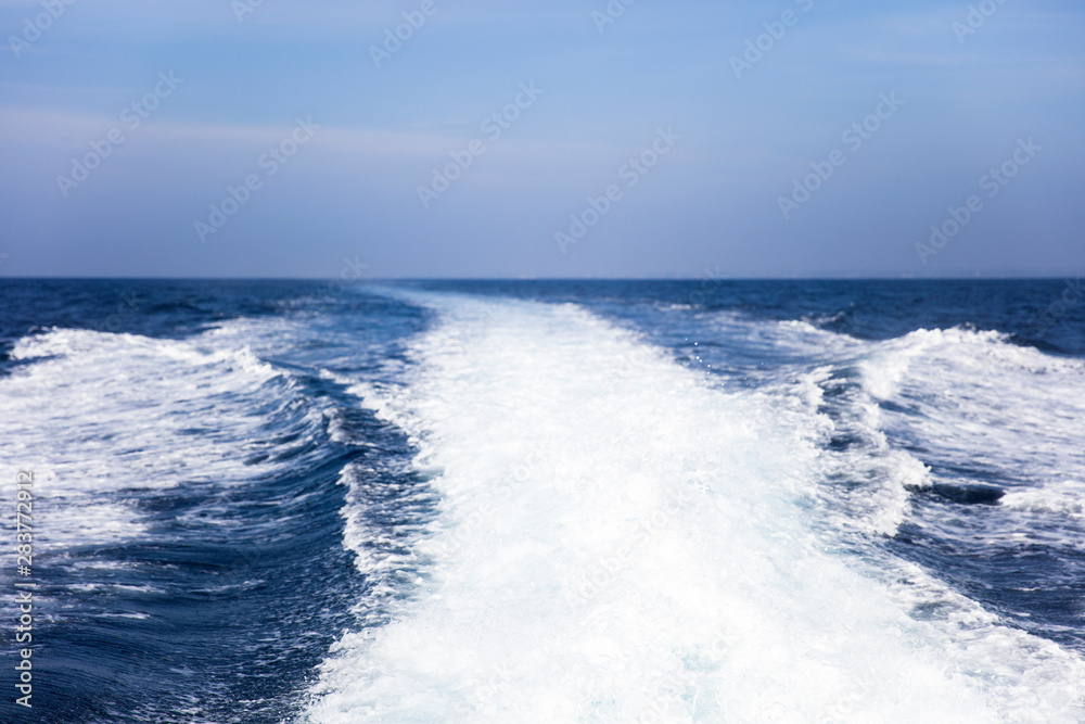 Water splash behind the  speed boat in the ocean