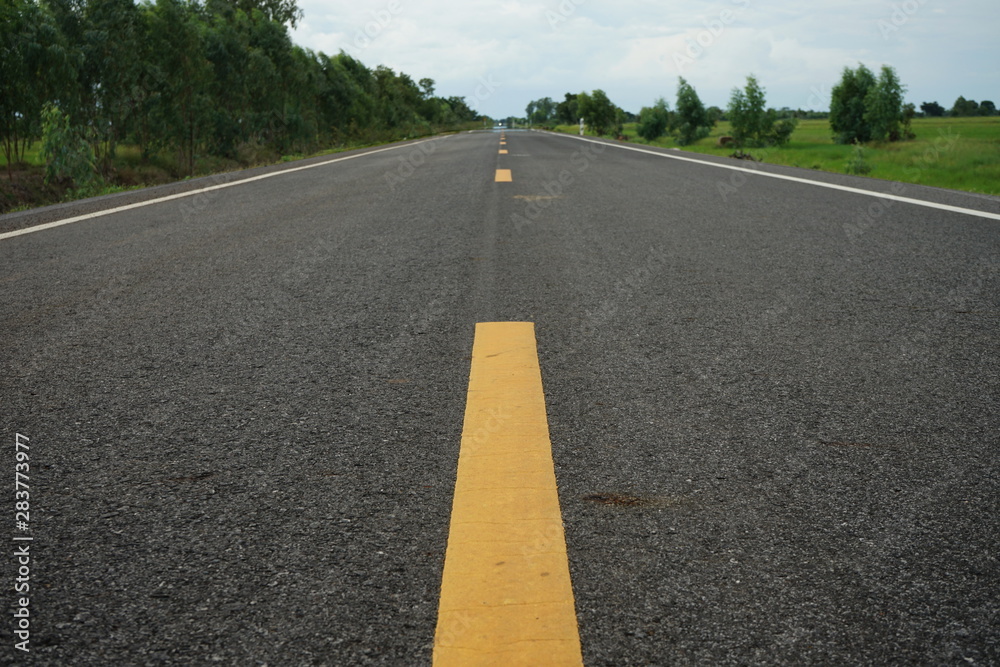 Road traffic paint Yellow on the asphalt surface