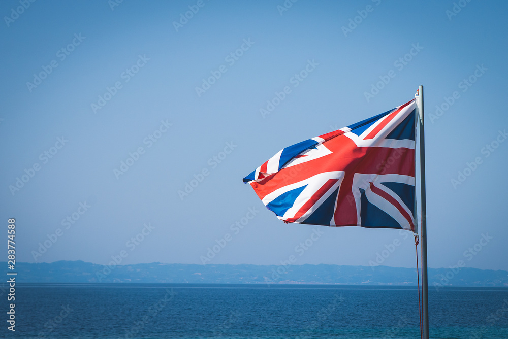 Fototapeta premium National flag of Great Britain at sea