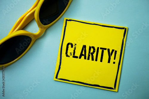 Writing note showing Clarity. Business photo showcasing Certainty Precision Purity Comprehensibility Transparency Accuracy Ideas messages blue background sunglasses casual annotations thoughts photo