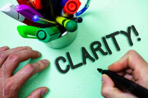 Text sign showing Clarity. Conceptual photo Certainty Precision Purity Comprehensibility Transparency Accuracy Man holding black marker white background markers intention communicate photo