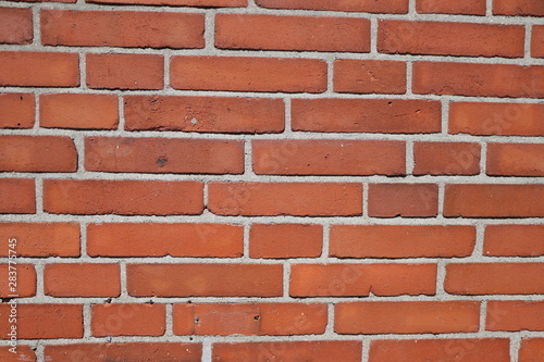 Background with an old wall of red bricks, texture and copy space