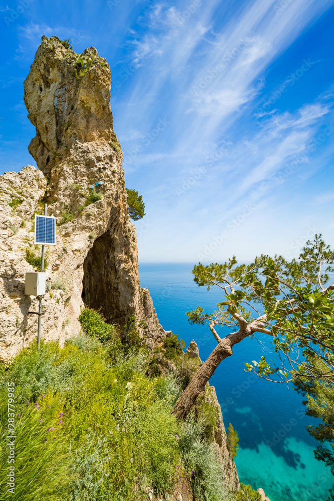 Side view of Arco Naturale, natural arch on coast of Capri island, Italy.