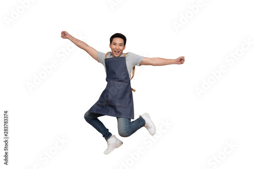 Startup successful small business owner man sme jumping isolated on white background, Asian man barista cafe local owner of coffee shop restaurant