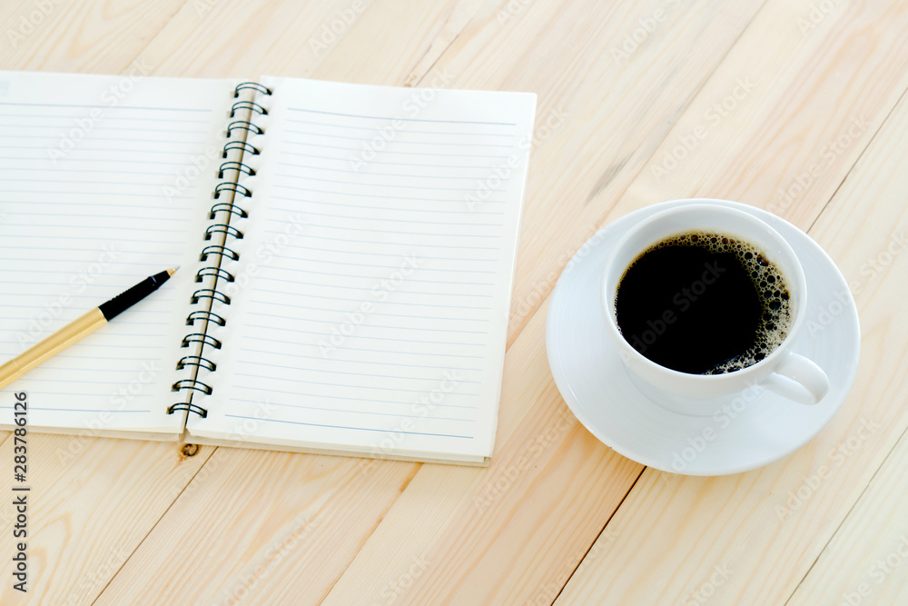 Working desk with notebook and coffee Working desk with notebook and coffee