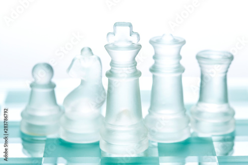 Transparent glass chess isolated on white