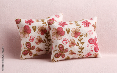 Two pillows with flowers and butterflies