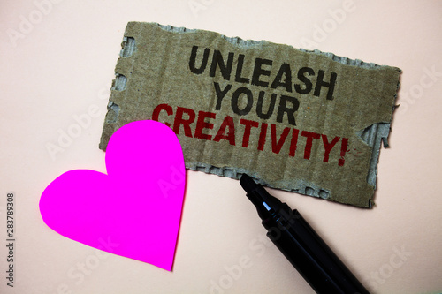 Text sign showing Unleash Your Creativity Call. Conceptual photo Develop Personal Intelligence Wittiness Wisdom Brown paperboard rough ideas message heart wild love lovely intentions photo