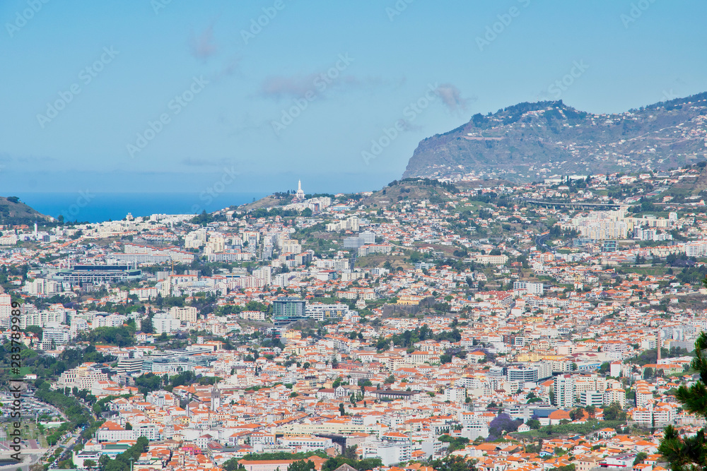 View to Funchal city and Atlantic ocean from the Viewpoint near Monte Funchal district, Madeira island, Portugal 